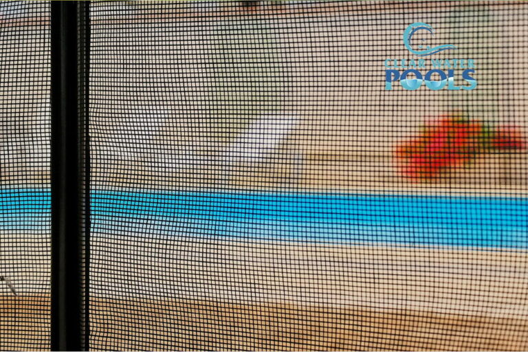 Close-up view of a mesh screen with a blurred blue pool and flowers in the background, highlighting pool safety; "ClearWater Pools" logo is visible in the top right corner.