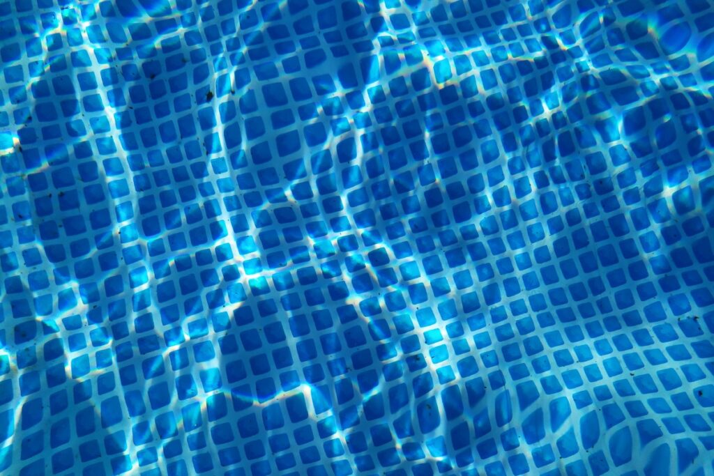 A close up of the water featuring pool lighting ideas.