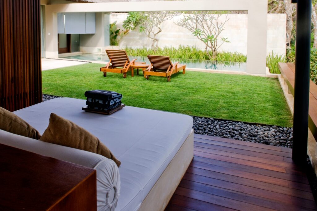 A cabana with a bed and chairs.