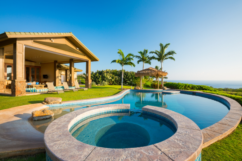 Explore the latest pool design trends in a stunning yard setting with a luxurious swimming pool.