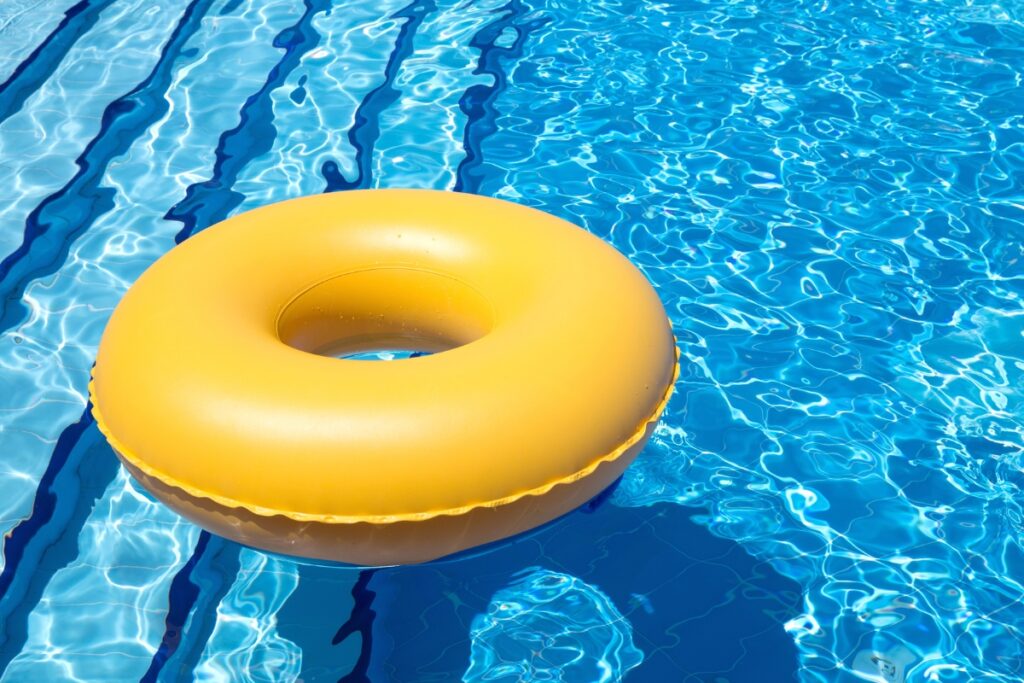 An inflatable ring floating in an energy-efficient swimming pool.