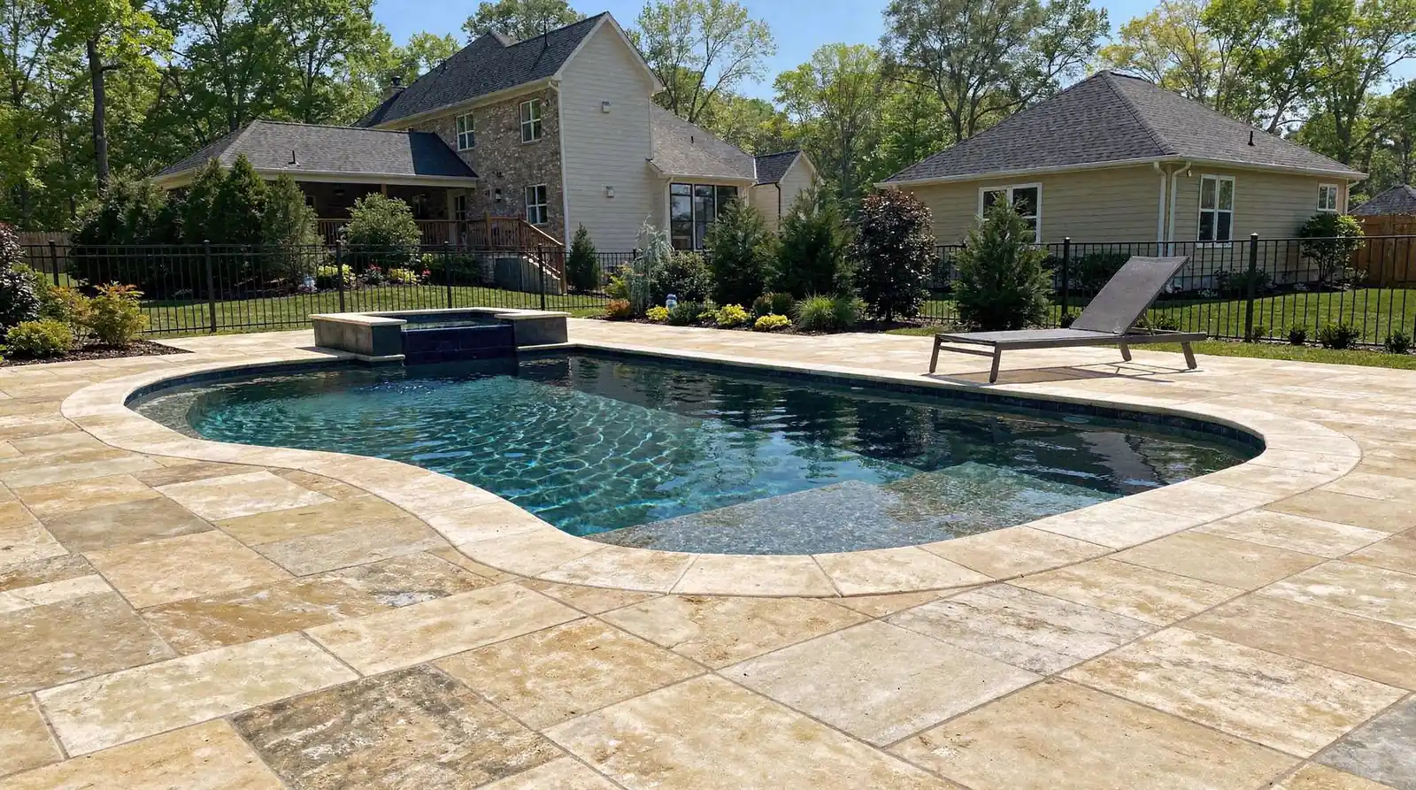 Natural stone options, including travertine, are frequently cited as a timeless choice for pool surrounds
